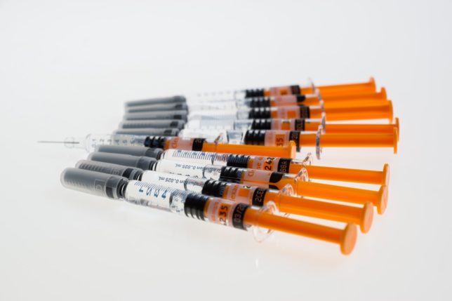 some orange syringes
