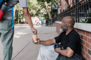 giving money to beggar